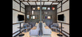 Modern living room with gray sofas, coffee tables, and wall-mounted televisions.